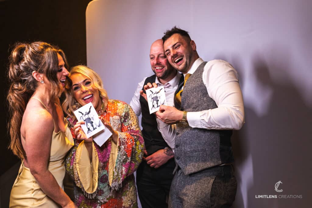 Friends showing their photobooth picture.