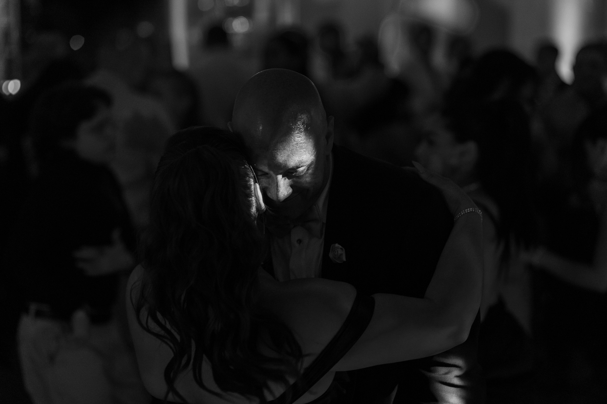 a black and white picture of a couple dancing