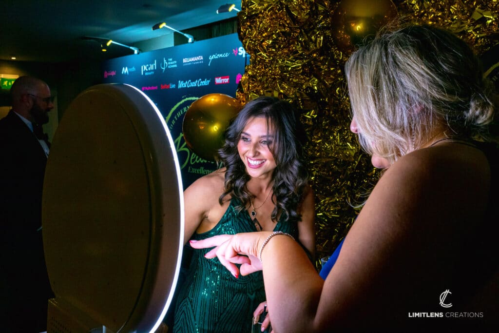 women showing how to use the booth
