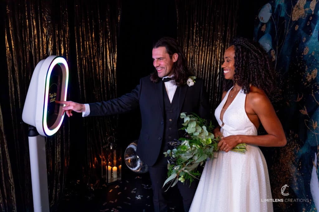 Wedding couple using ring light photo booth.
