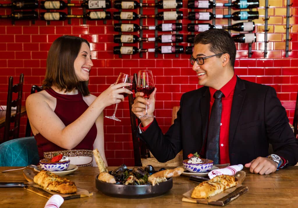 A couple enjoying wine.