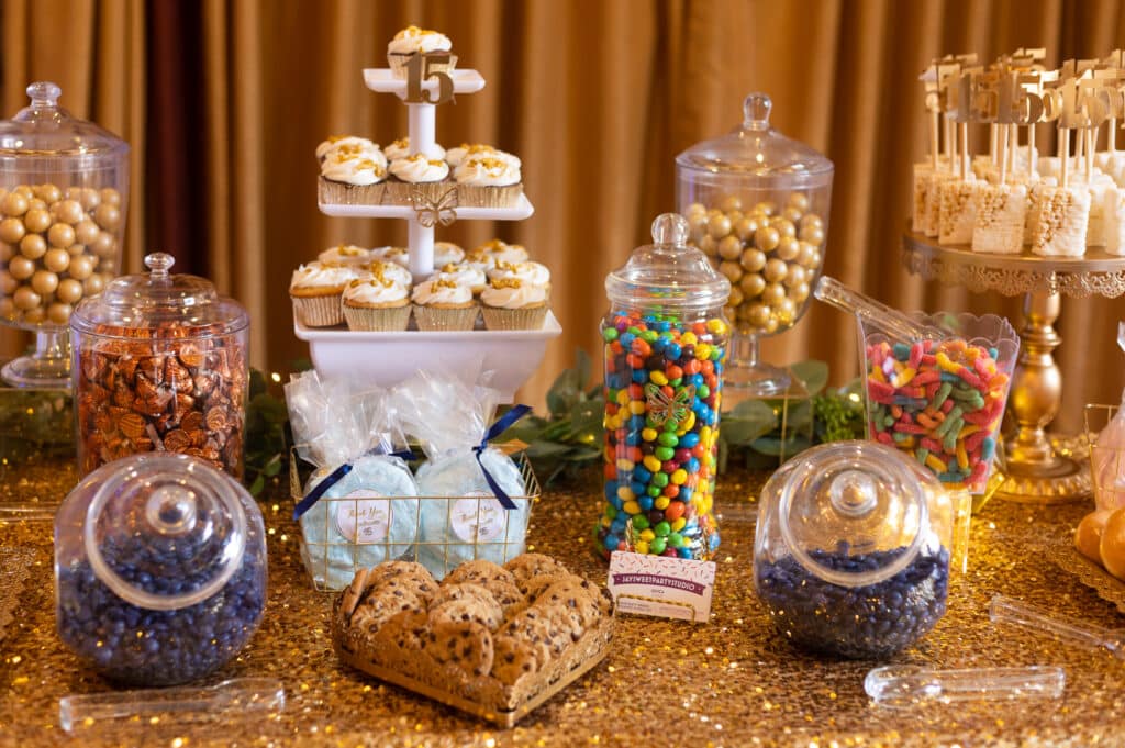 Dessert table with tiered display of sweets.